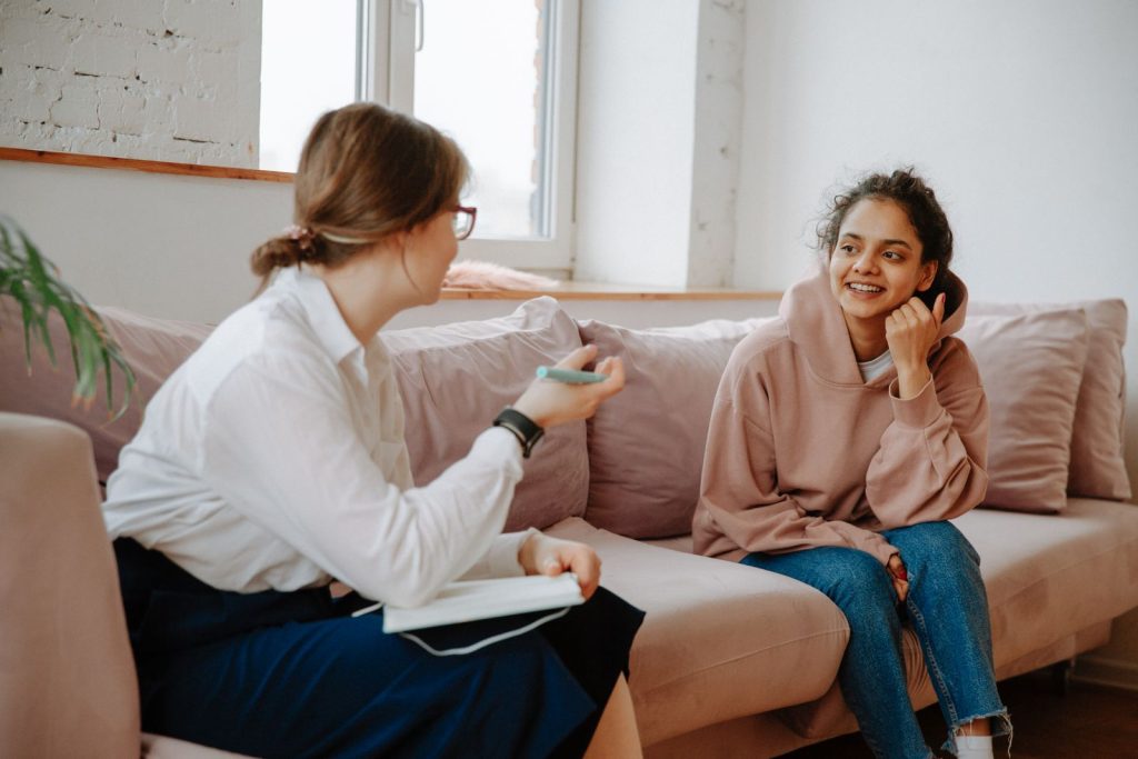 A psychologist and a young person talking